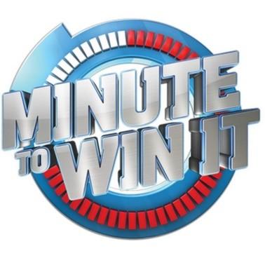 Minute to Win It logo. The words "Minute to Win It" are written in silver in the middle of a blue stopwatch shape, with red and white ticks around the edge to indicate how much time has been used.