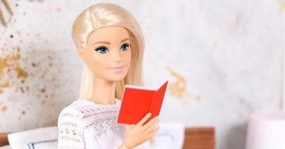 Barbie doll reading a miniature book