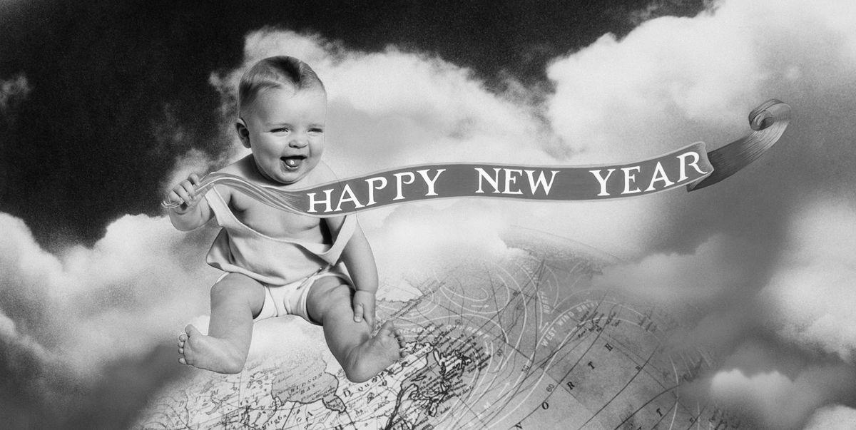 Baby sitting on a cloud with a banner that says "Happy New Year!"