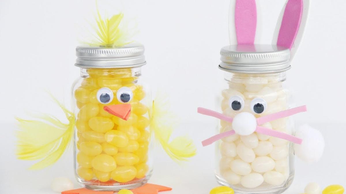 Two mason jars decorated to look like a baby chick and a bunny