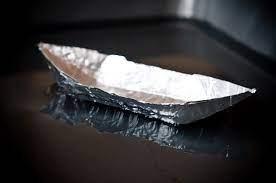 Photo of a model boat built out of aluminum foil.